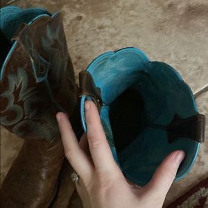 Selling a bootcut teal an brown boot. Wore them four times, getting rid of them